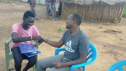  Scholastic Kinaka Michael, SJ (right) and Jerica the hero (Left), exchange joy and words of encouragement during the celebration held at Jerica’s family.